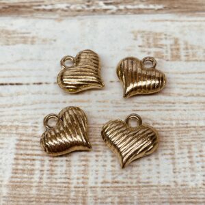 Dije dorado corazón infla rayas 16952