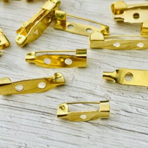 Base de prendedor dorado